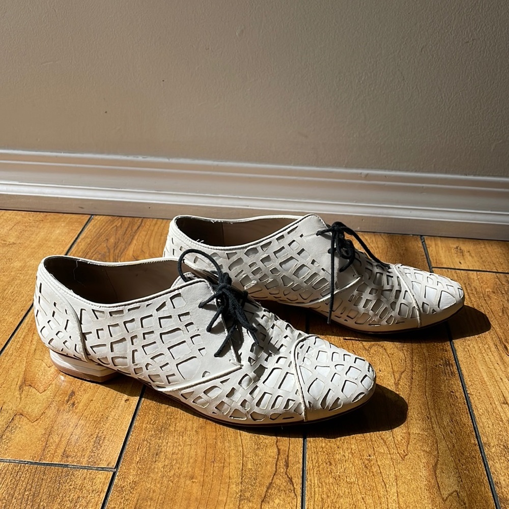MADONNA white loafers with lazer cut details.
Size 9 worn a handful of times